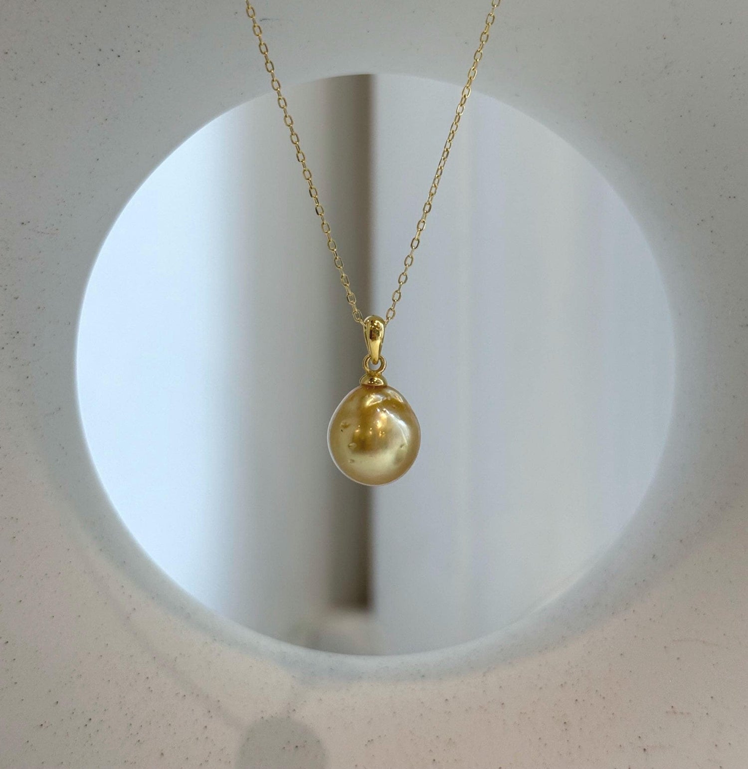 Elly’s 10.8mm South Sea deep tea Gold ocean Pearl pendant: Extreme luster mirrored, 1.9cm high, S925 silver w/ gold plated pendant.