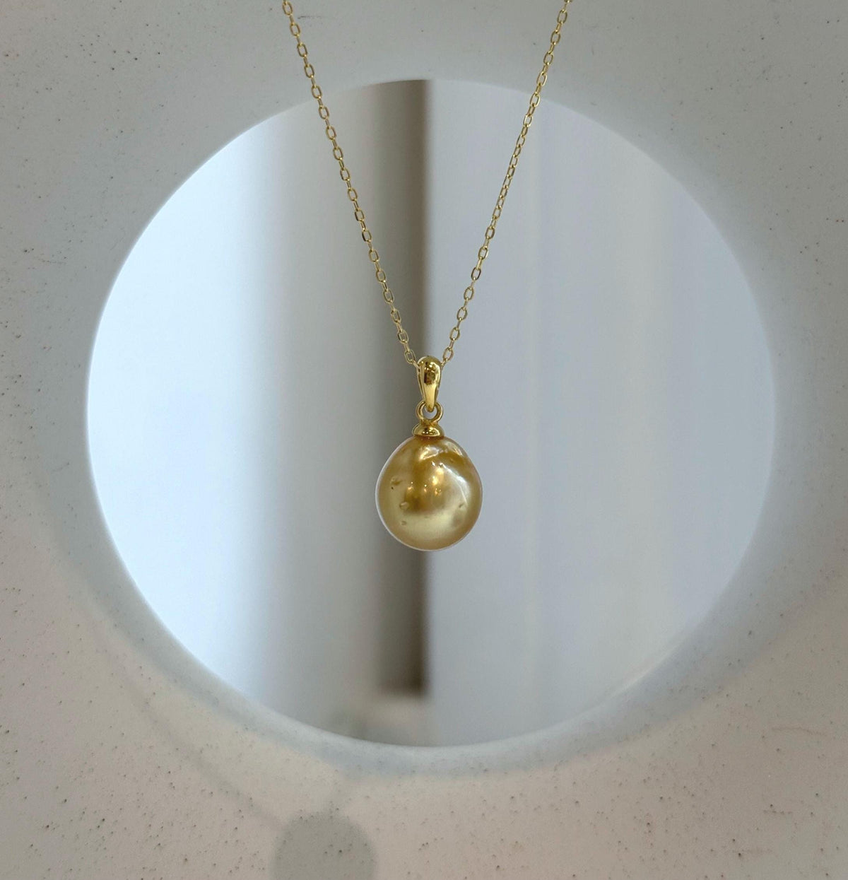Elly’s 10.8mm South Sea deep tea Gold ocean Pearl pendant: Extreme luster mirrored, 1.9cm high, S925 silver w/ gold plated pendant.