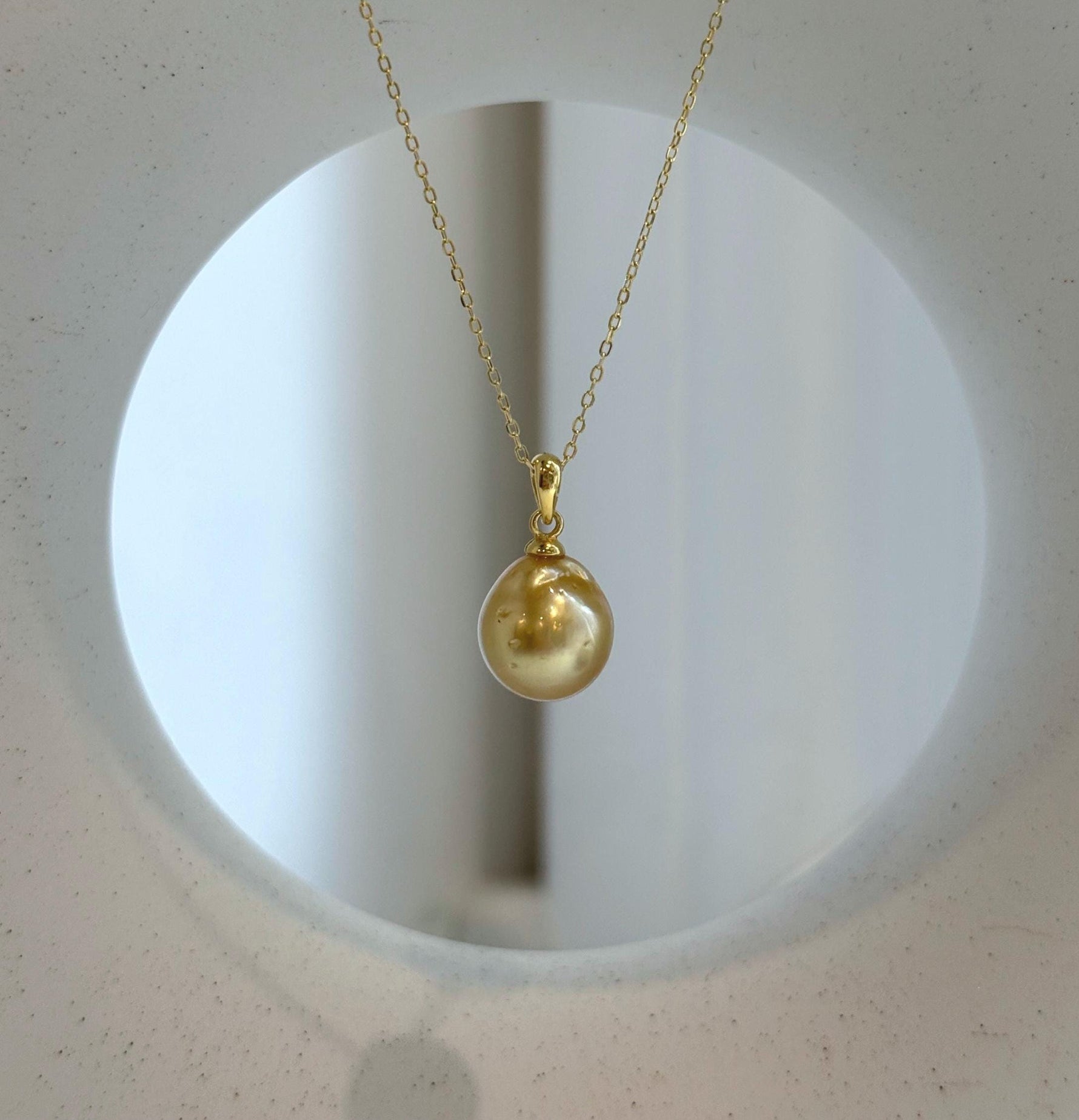 Elly’s 10.8mm South Sea deep tea Gold ocean Pearl pendant: Extreme luster mirrored, 1.9cm high, S925 silver w/ gold plated pendant.