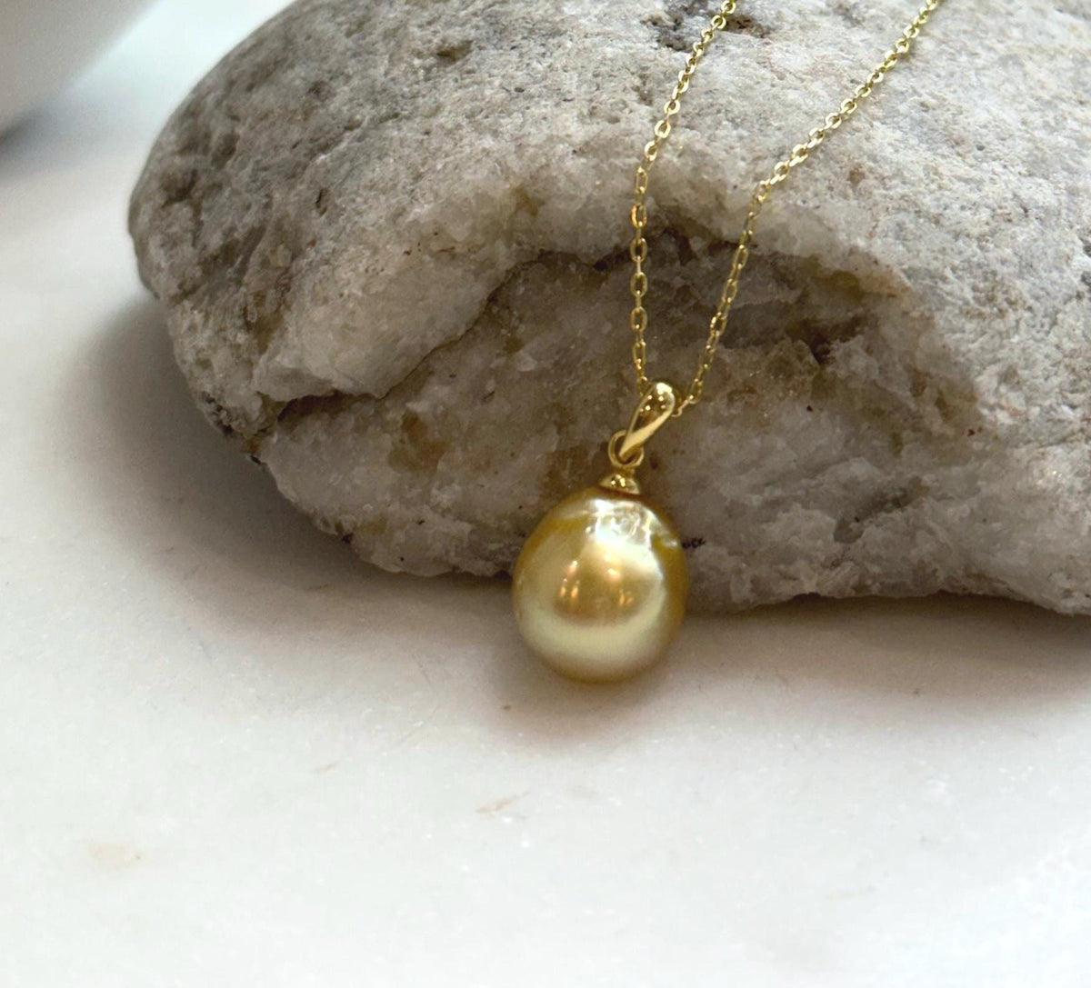 Elly’s 10.8mm South Sea deep tea Gold ocean Pearl pendant: Extreme luster mirrored, 1.9cm high, S925 silver w/ gold plated pendant.