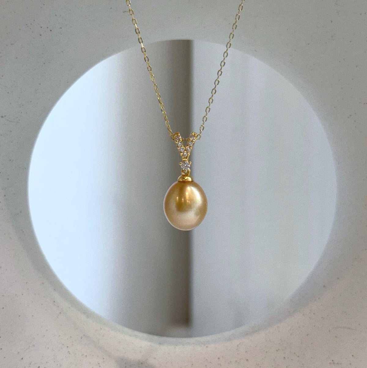 Elly’s 10mm South Sea deep Gold iridescent ocean Pearl pendant: Extreme luster mirrored, 2.2cm high, S925 silver w/ gold plated pendant.