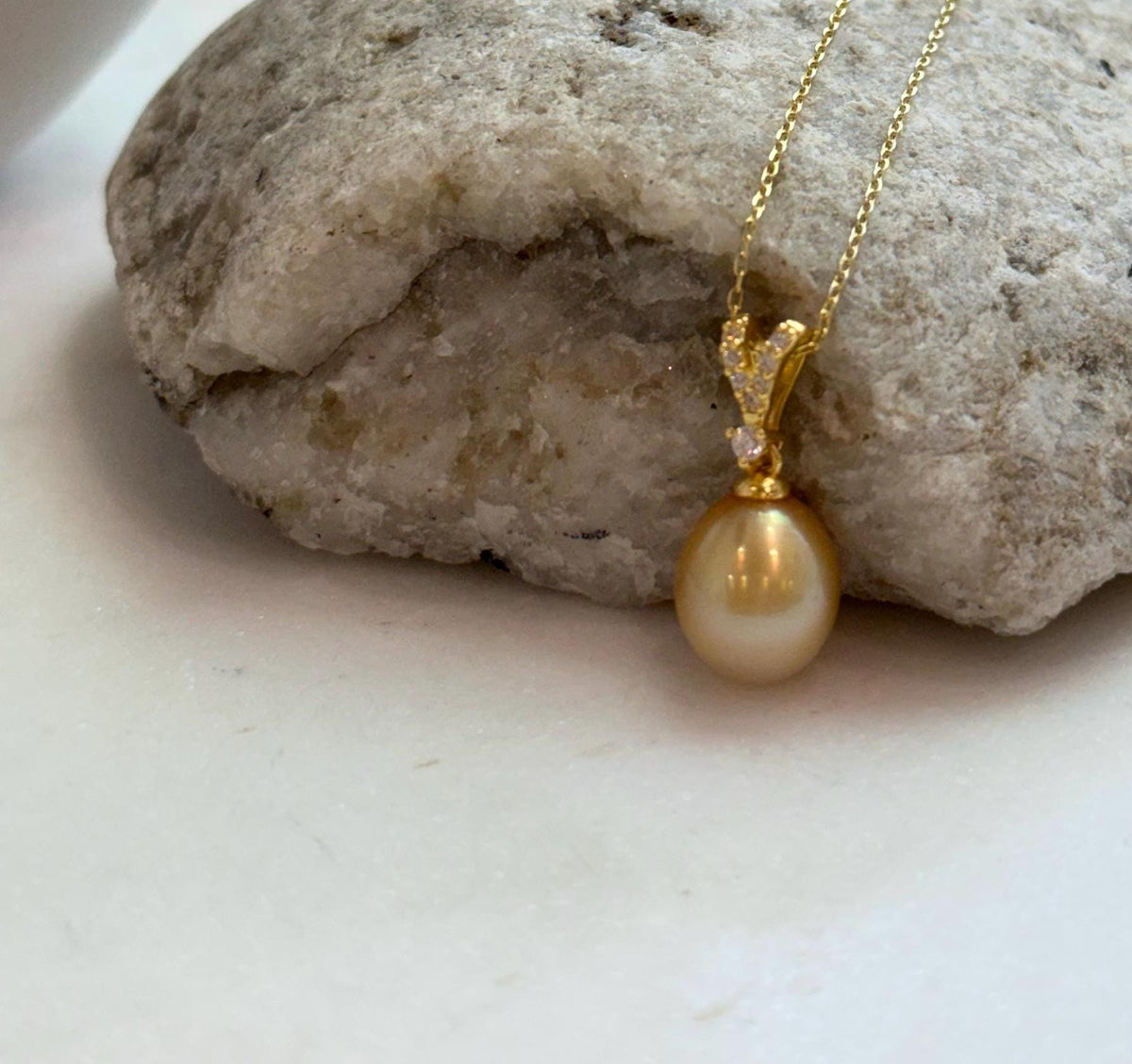 Elly’s 10mm South Sea deep Gold iridescent ocean Pearl pendant: Extreme luster mirrored, 2.2cm high, S925 silver w/ gold plated pendant.