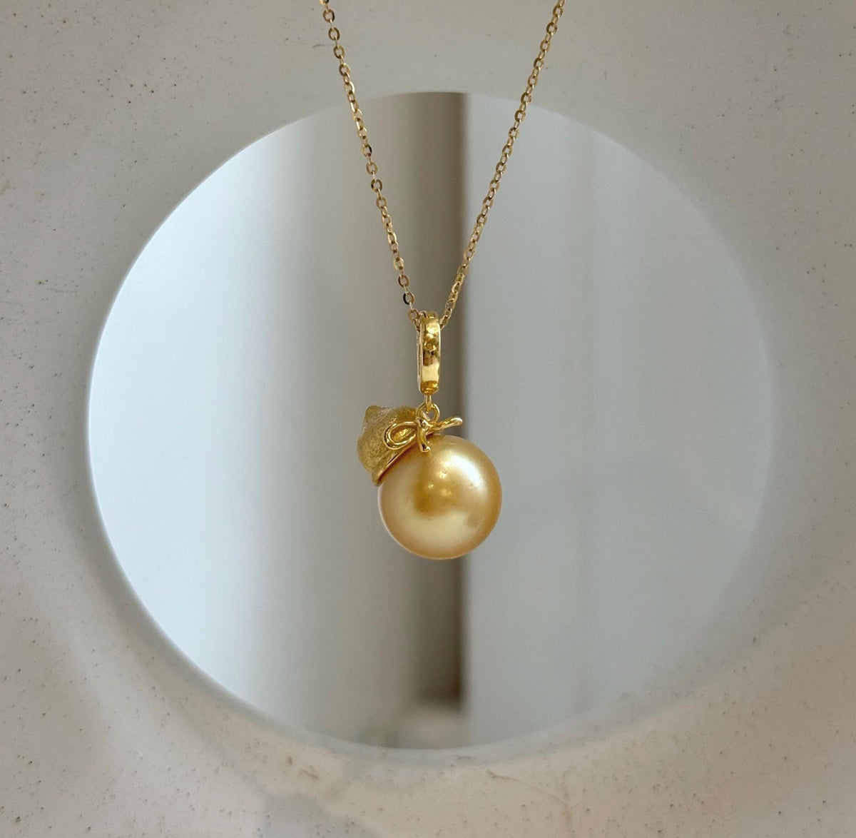 Elly’s 12.5mm South Sea deep Gold ocean Pearl pendant: Extreme luster mirrored, 2.5cm high, S925 silver w/ gold plated pendant.