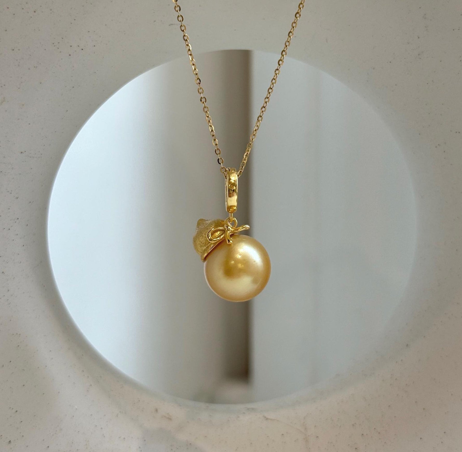 Elly’s 12.5mm South Sea deep Gold ocean Pearl pendant: Extreme luster mirrored, 2.5cm high, S925 silver w/ gold plated pendant.