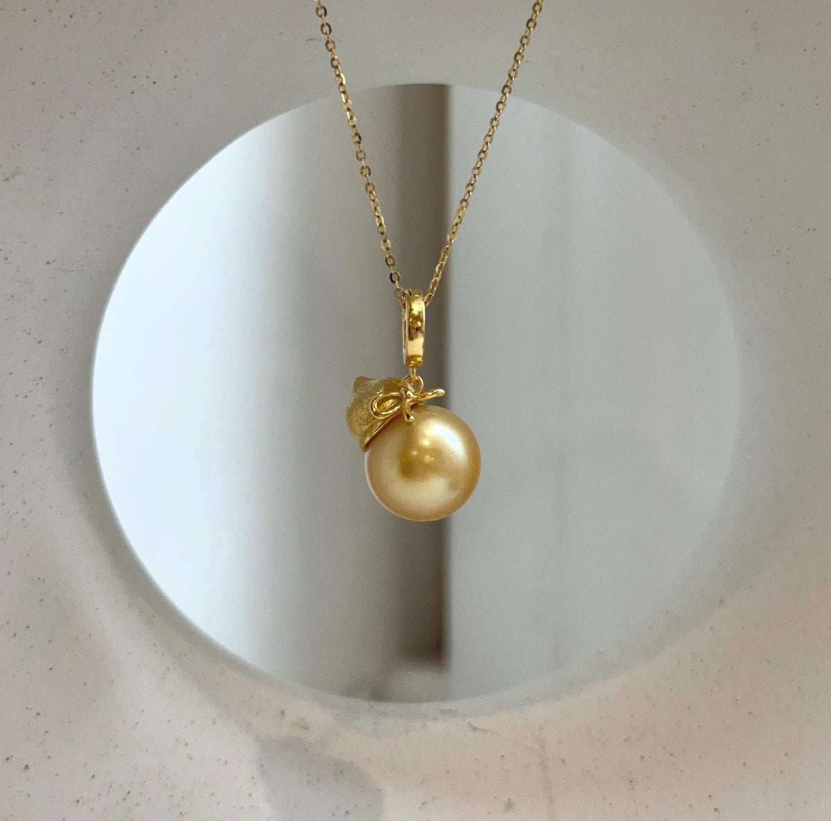 Elly’s 12.5mm South Sea deep Gold ocean Pearl pendant: Extreme luster mirrored, 2.5cm high, S925 silver w/ gold plated pendant.