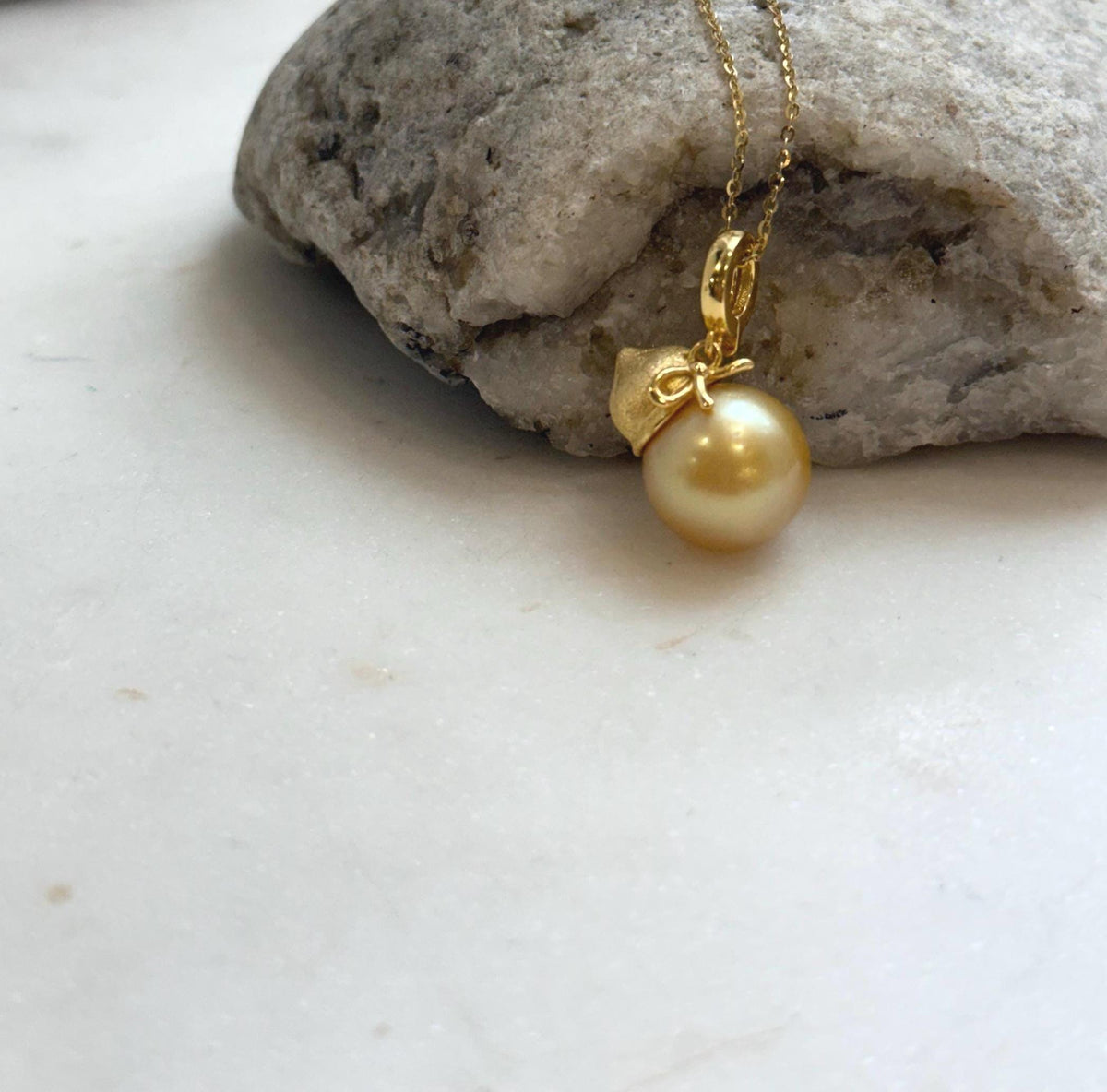 Elly’s 12.5mm South Sea deep Gold ocean Pearl pendant: Extreme luster mirrored, 2.5cm high, S925 silver w/ gold plated pendant.