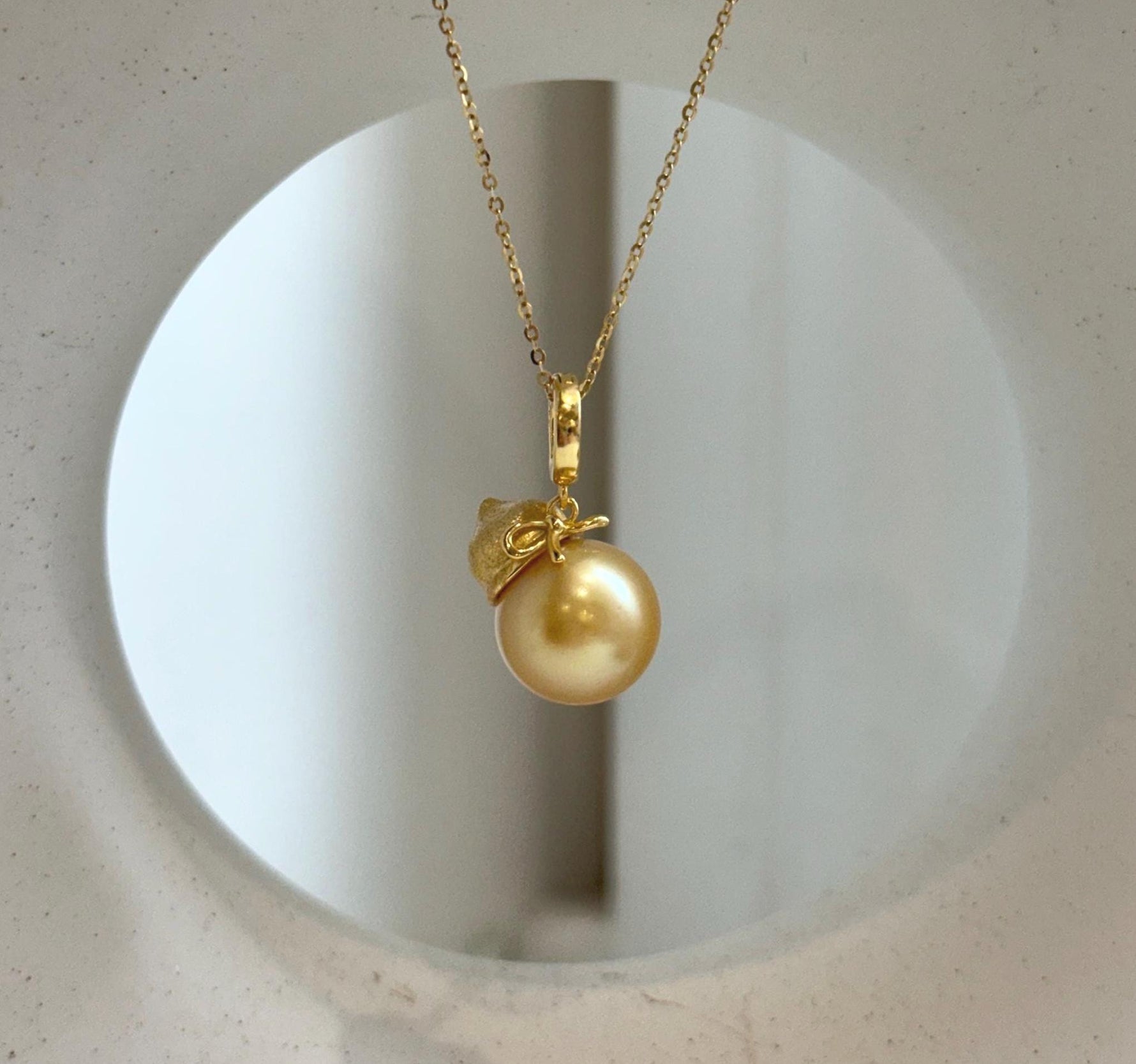 Elly’s 12.5mm South Sea deep Gold ocean Pearl pendant: Extreme luster mirrored, 2.5cm high, S925 silver w/ gold plated pendant.