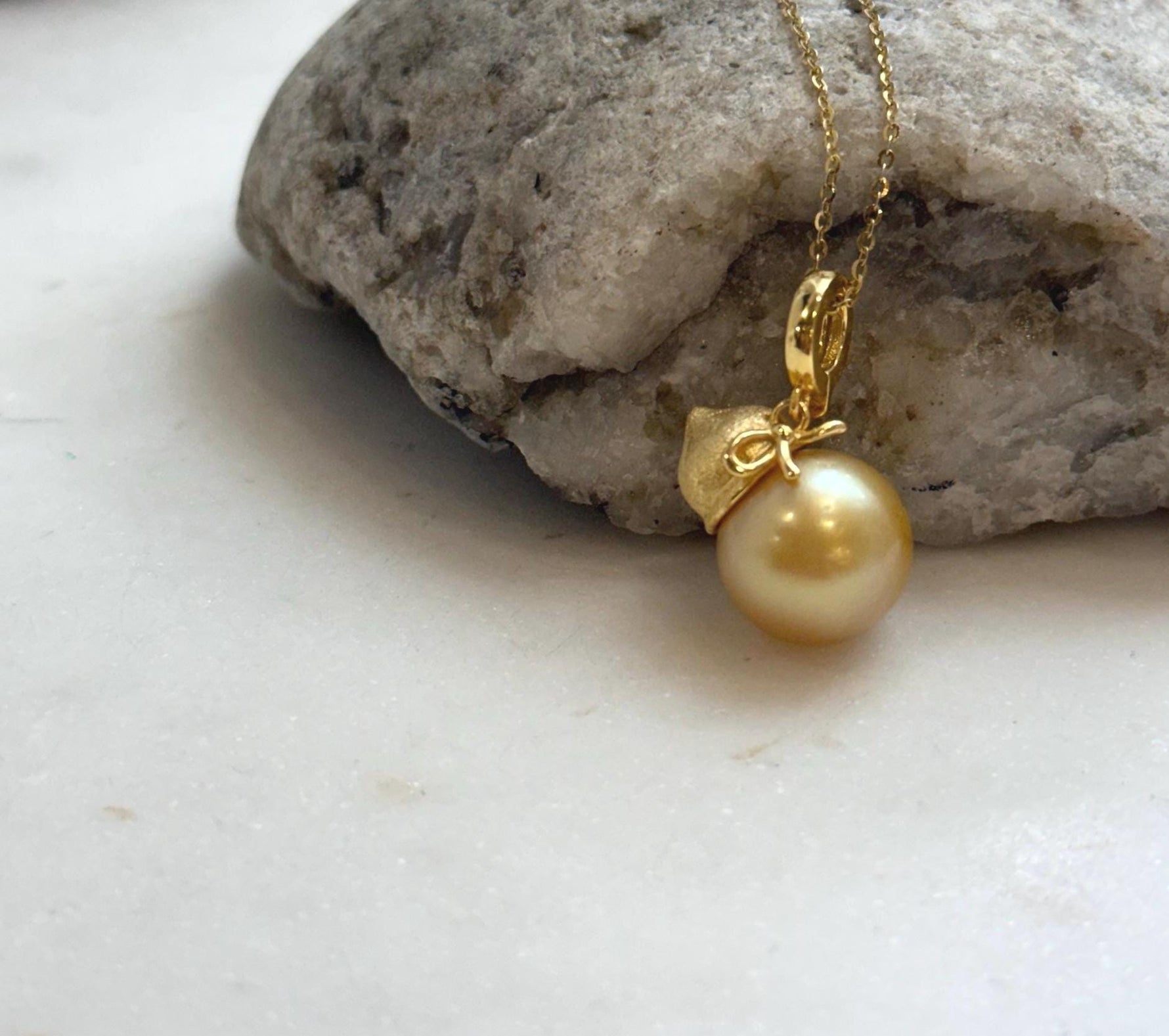 Elly’s 12.5mm South Sea deep Gold ocean Pearl pendant: Extreme luster mirrored, 2.5cm high, S925 silver w/ gold plated pendant.