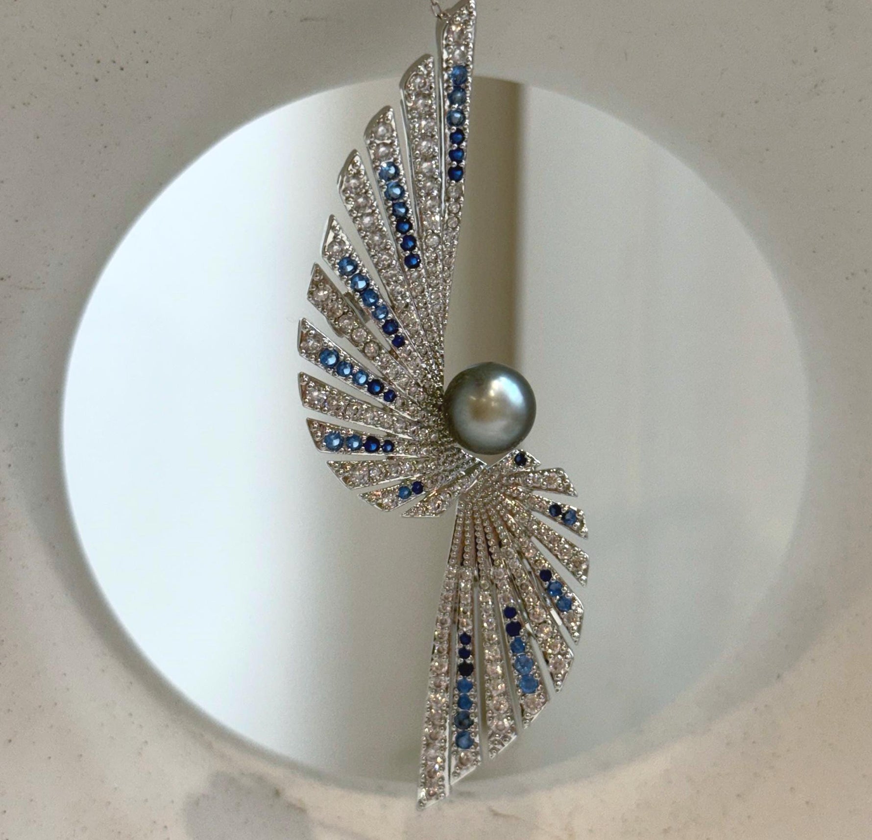 Elly’s 8.5mm Tahitian platinum blue Ocean feather Brooch Pendant 2in1: Extreme Luster mirrored, no chain.
