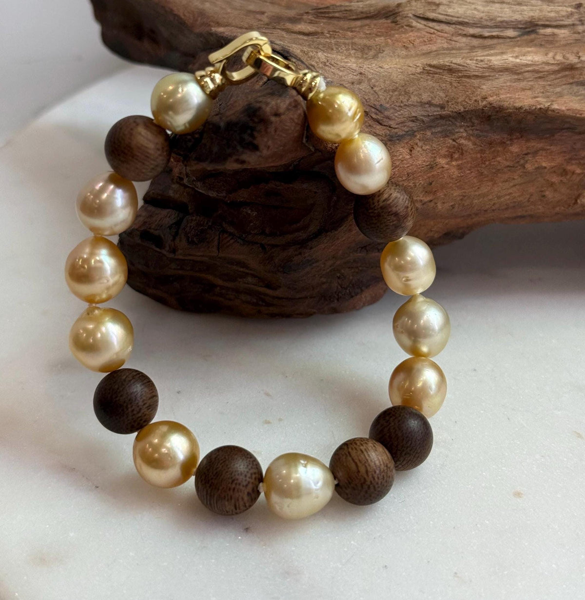 Elly’s 11pcs Genius South Sea Golden ocean Pearls Agarwood bracelet: Extreme luster, 8.9-10.5mm, 8.2” knotted.