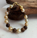 Elly’s 11pcs Genius South Sea Golden ocean Pearls Agarwood bracelet: Extreme luster, 8.9-10.5mm, 8.2” knotted.