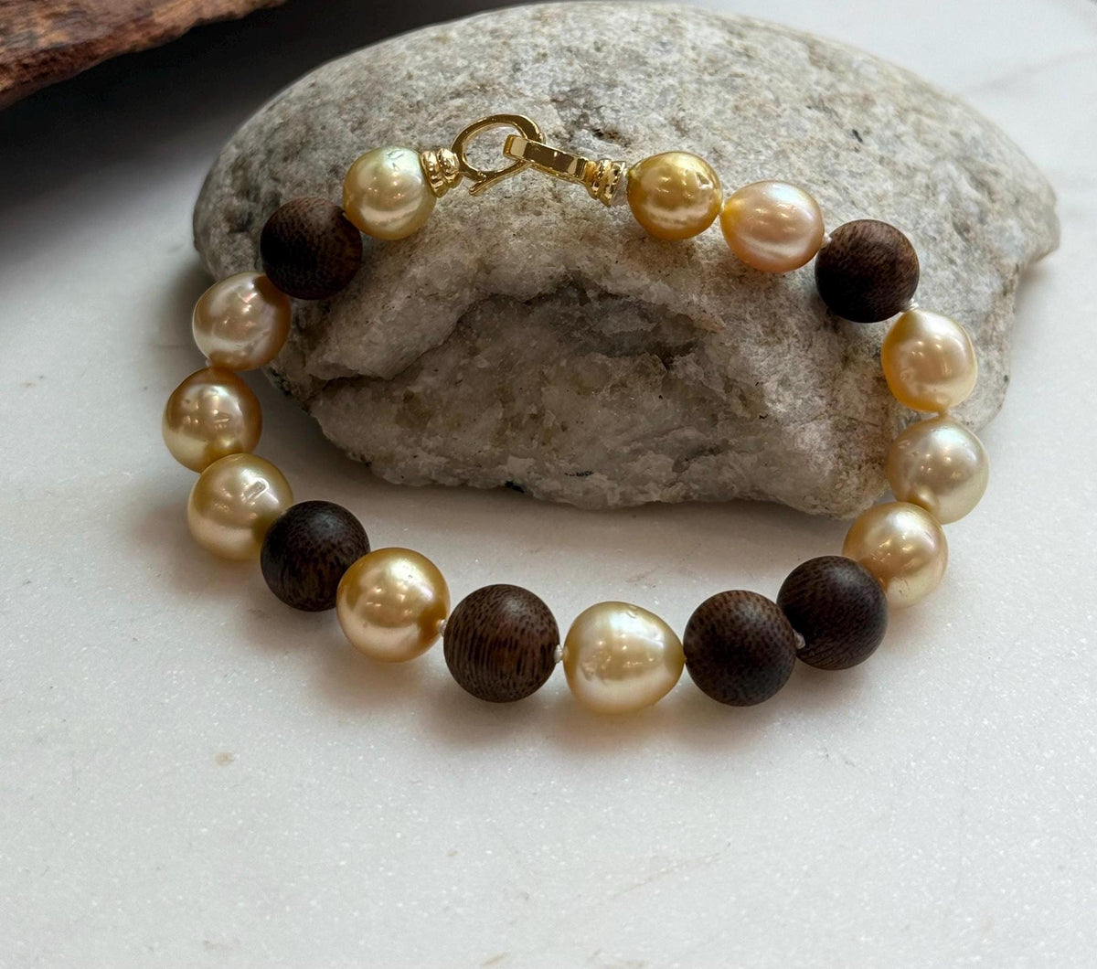 Elly’s 11pcs Genius South Sea Golden ocean Pearls Agarwood bracelet: Extreme luster, 8.9-10.5mm, 8.2” knotted.