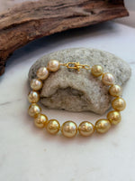 Elly’s 10.4-13.4mm 15pcs Genius South sea golden Ocean Pearls bracelet: Extreme luster, 8.5”, S925 silver bracelet.