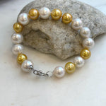 Elly’s 17pcs 10.2-11.5mm White golden Edison Pearls Bracelet: Extreme luster mirrored, 8.3” knotted, S925 silver Bracelet.