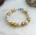 Elly’s 17pcs 10.2-11.5mm White golden Edison Pearls Bracelet: Extreme luster mirrored, 8.3” knotted, S925 silver Bracelet.