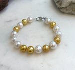 Elly’s 17pcs 10.2-11.5mm White golden Edison Pearls Bracelet: Extreme luster mirrored, 8.3” knotted, S925 silver Bracelet.