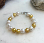 Elly’s 17pcs 10.2-11.5mm White golden Edison Pearls Bracelet: Extreme luster mirrored, 8.3” knotted, S925 silver Bracelet.