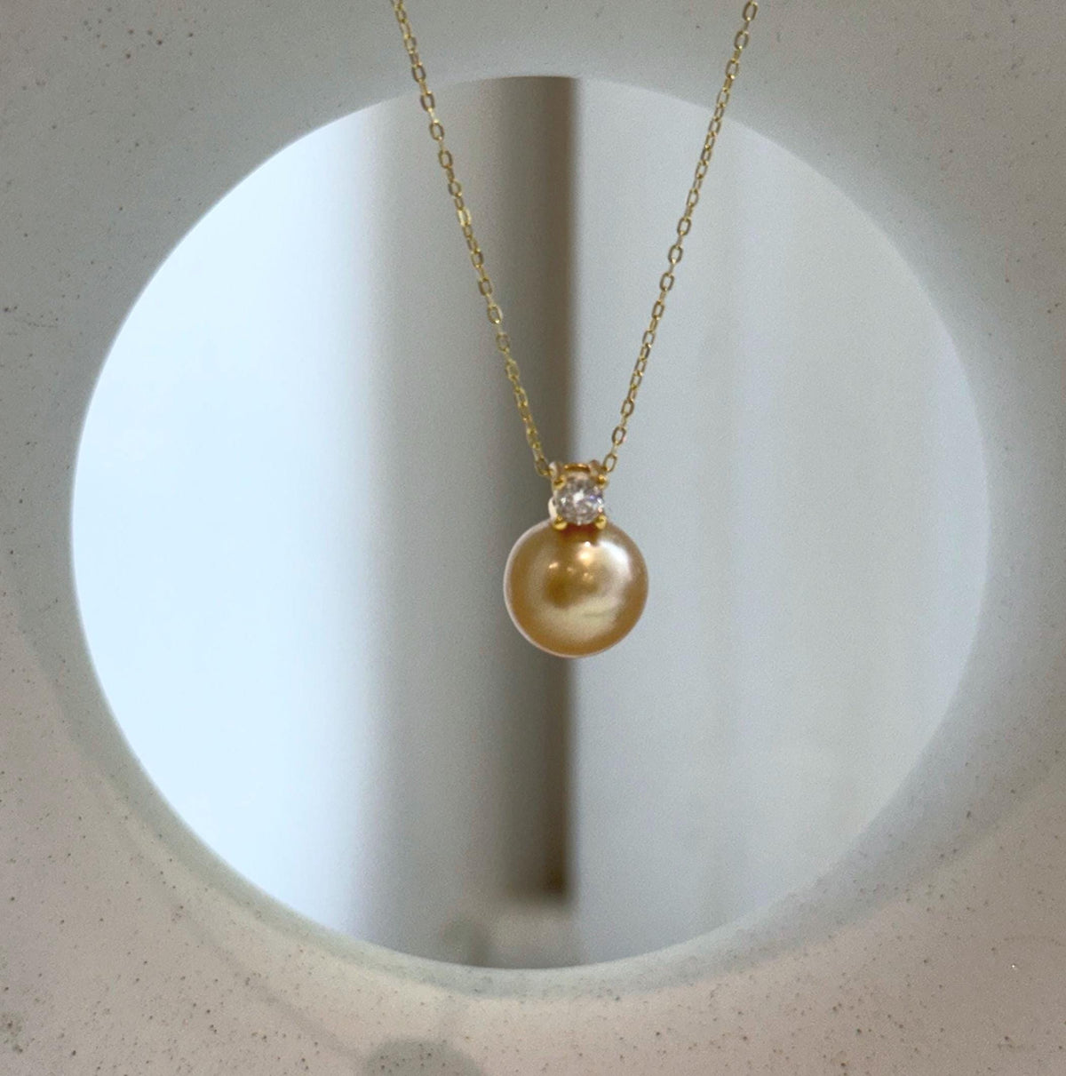 Elly’s 10.9mm South Sea deep Gold ocean Pearl pendant: Extreme luster mirrored, 1.5cm high, S925 silver w/ gold plated pendant.