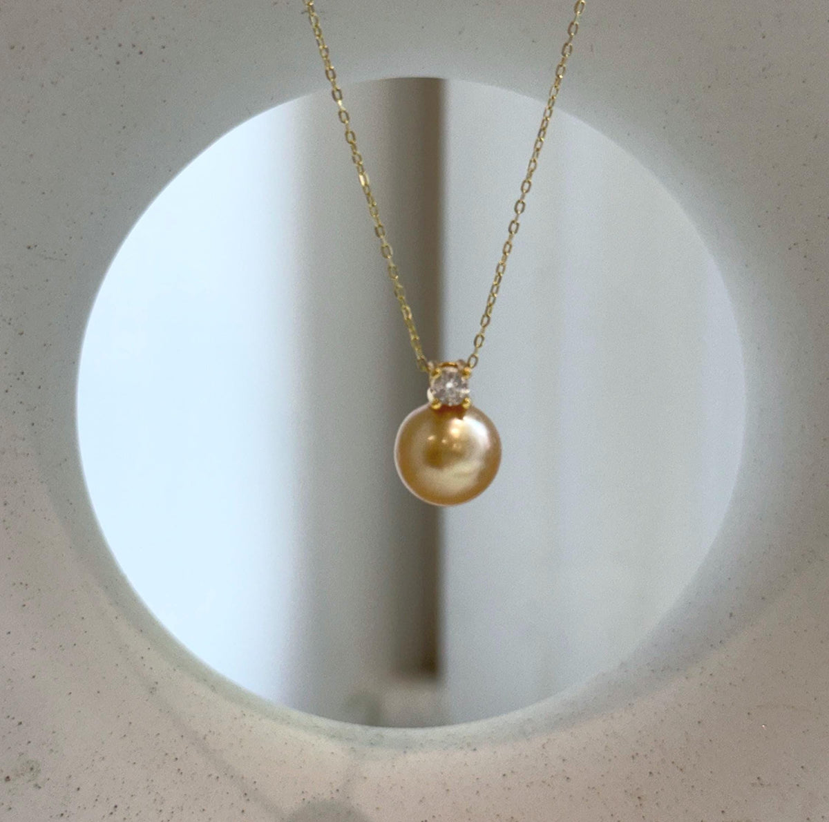 Elly’s 10.9mm South Sea deep Gold ocean Pearl pendant: Extreme luster mirrored, 1.5cm high, S925 silver w/ gold plated pendant.