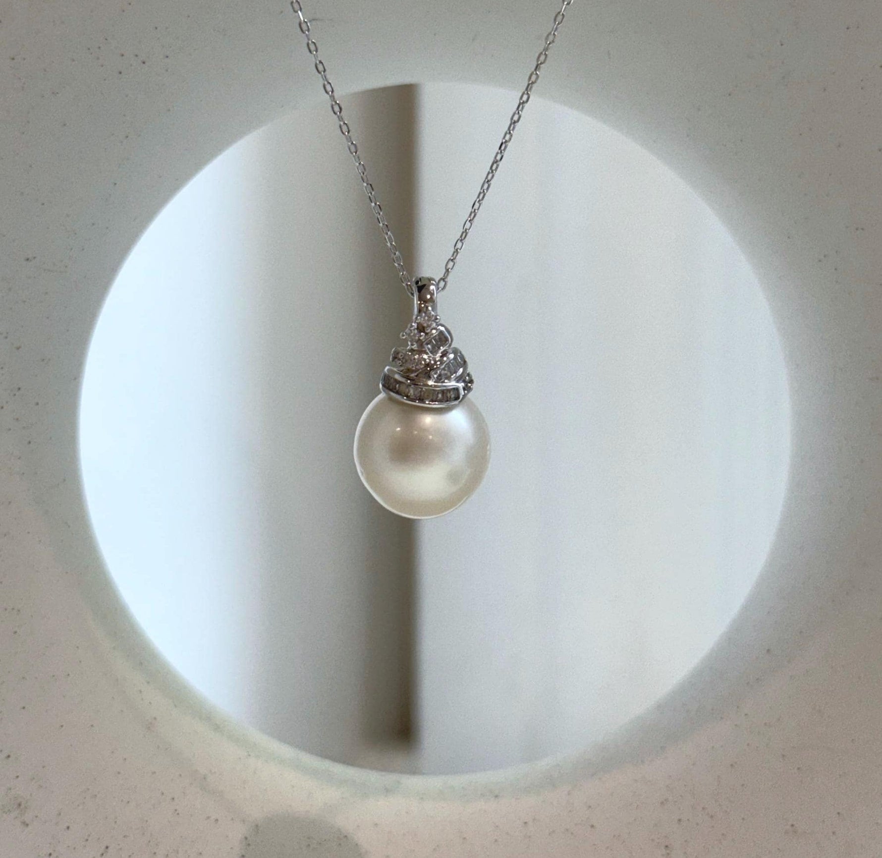 Elly’s 13.4mm South Sea White ocean Pearl pendant: Extreme luster mirrored, 2.4cm high, S925 silver w/ gold plated pendant.