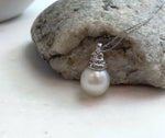 Elly’s 13.4mm South Sea White ocean Pearl pendant: Extreme luster mirrored, 2.4cm high, S925 silver w/ gold plated pendant.