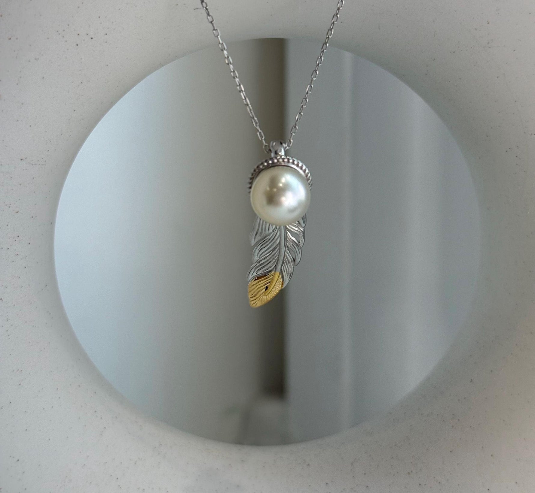 Elly’s 9.3mm Genius South sea ivory Ocean Pearl leather Pendant: Extreme luster mirrored, 1x3cm, S925 silver pendant.