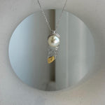 Elly’s 9.3mm Genius South sea ivory Ocean Pearl leather Pendant: Extreme luster mirrored, 1x3cm, S925 silver pendant.