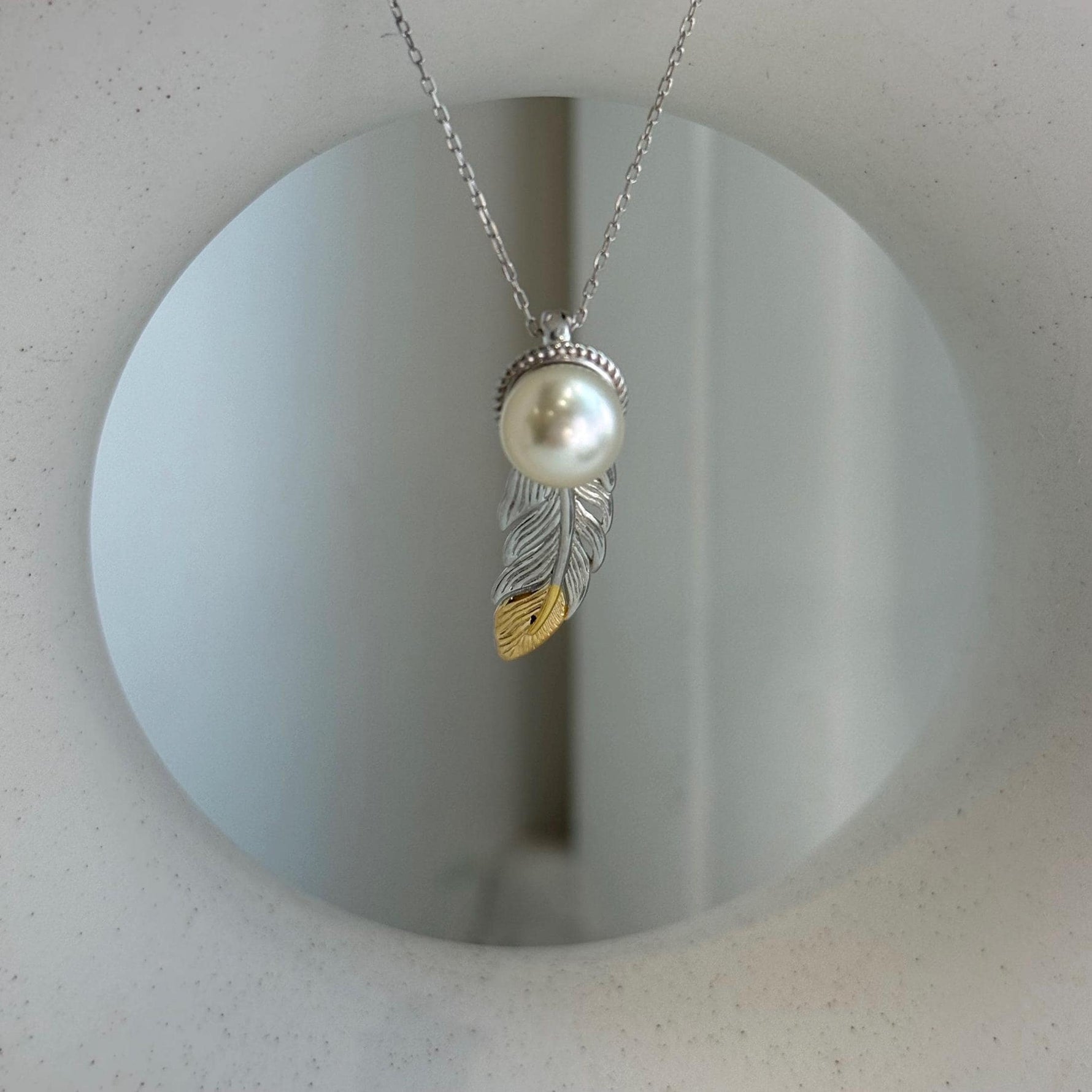 Elly’s 9.3mm Genius South sea ivory Ocean Pearl leather Pendant: Extreme luster mirrored, 1x3cm, S925 silver pendant.