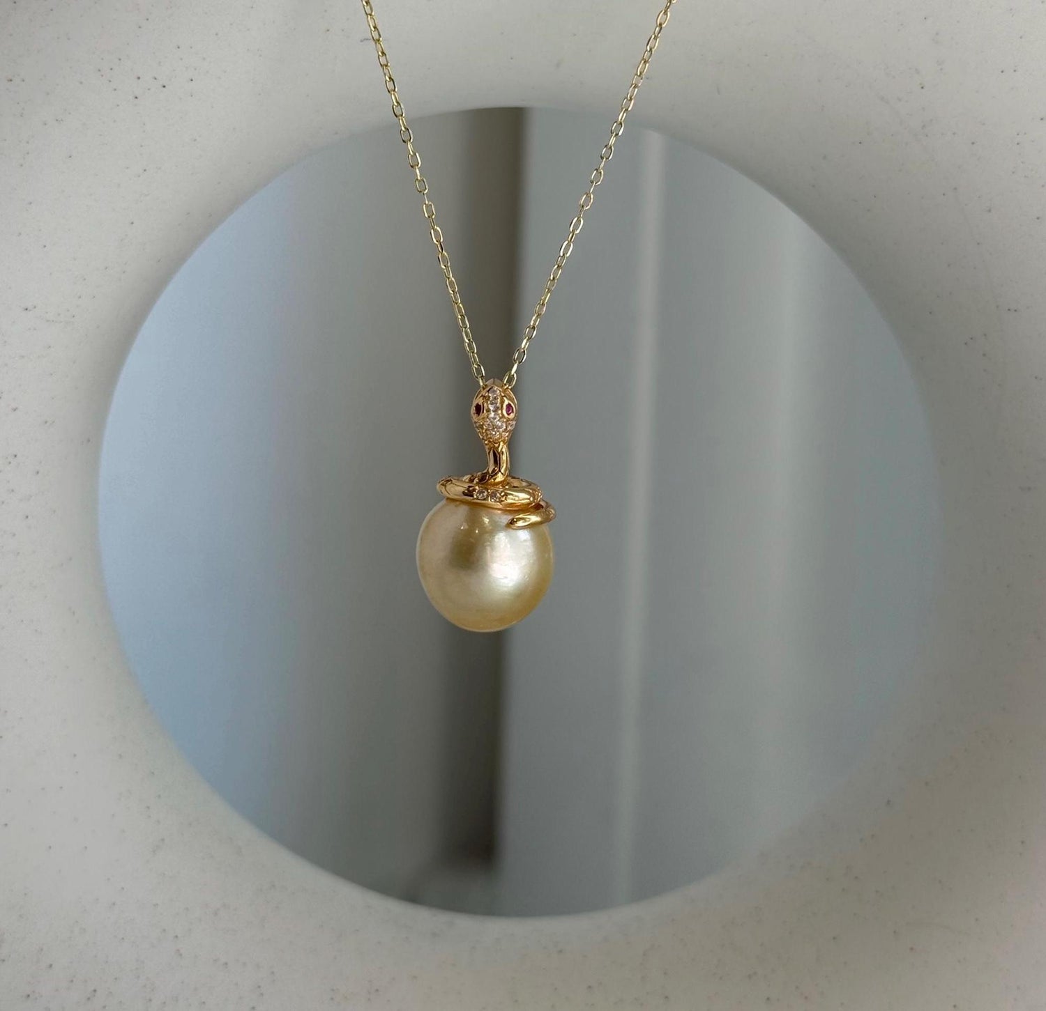 Elly’s 11.6mm South Sea Gold iridescent ocean Pearl Snake pendant: Extreme luster mirrored, 2.1cm high, S925 silver pendant.