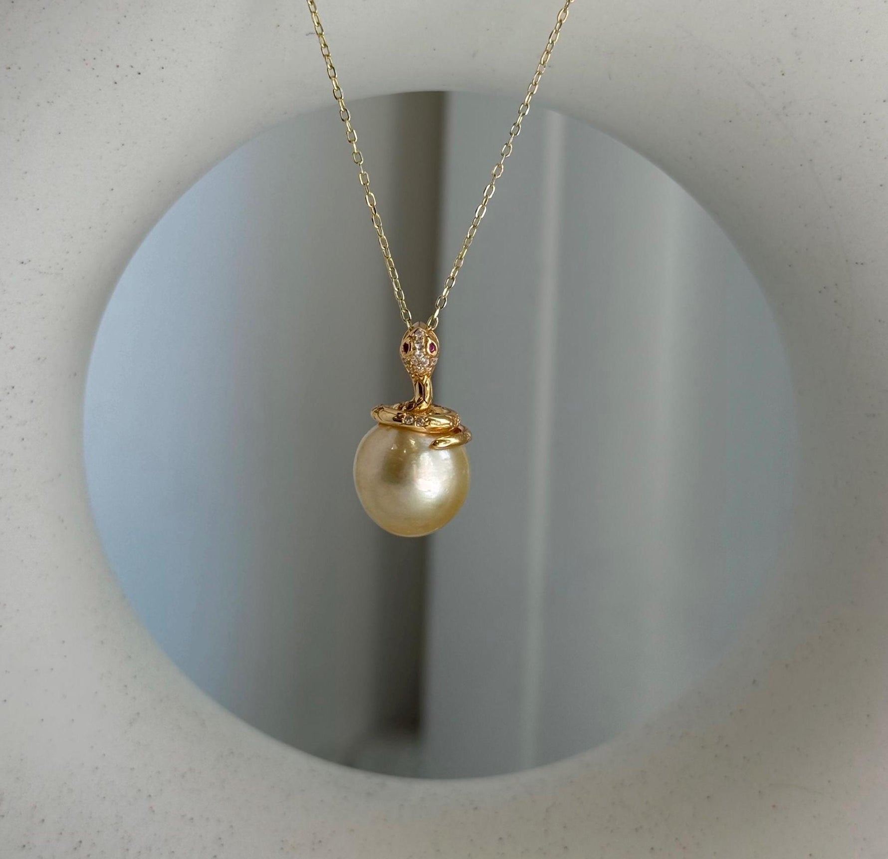 Elly’s 11.6mm South Sea Gold iridescent ocean Pearl Snake pendant: Extreme luster mirrored, 2.1cm high, S925 silver pendant.