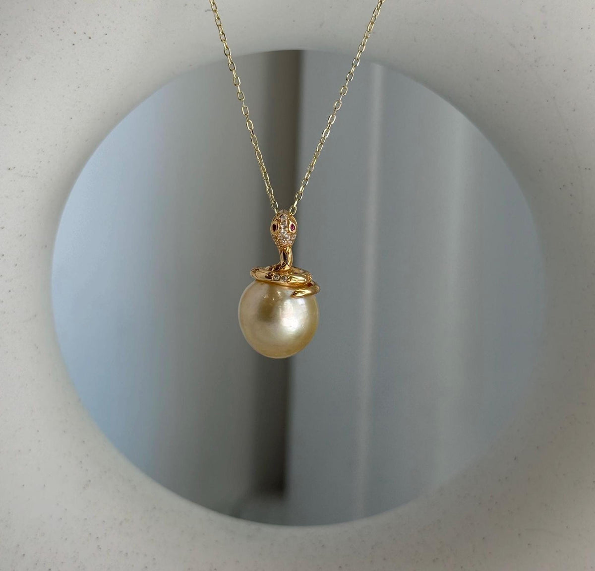 Elly’s 11.6mm South Sea Gold iridescent ocean Pearl Snake pendant: Extreme luster mirrored, 2.1cm high, S925 silver pendant.