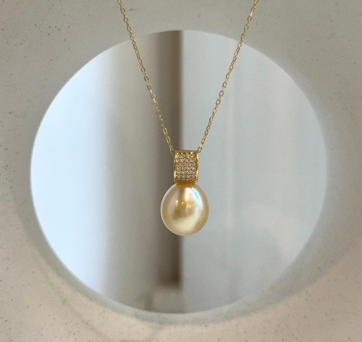 Elly’s 11.4mm South Sea Golden iridescent ocean Pearl pendant: Extreme luster mirrored, 2cm high, S925 silver w/ gold plated pendant.