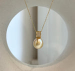 Elly’s 11.4mm South Sea Golden iridescent ocean Pearl pendant: Extreme luster mirrored, 2cm high, S925 silver w/ gold plated pendant.