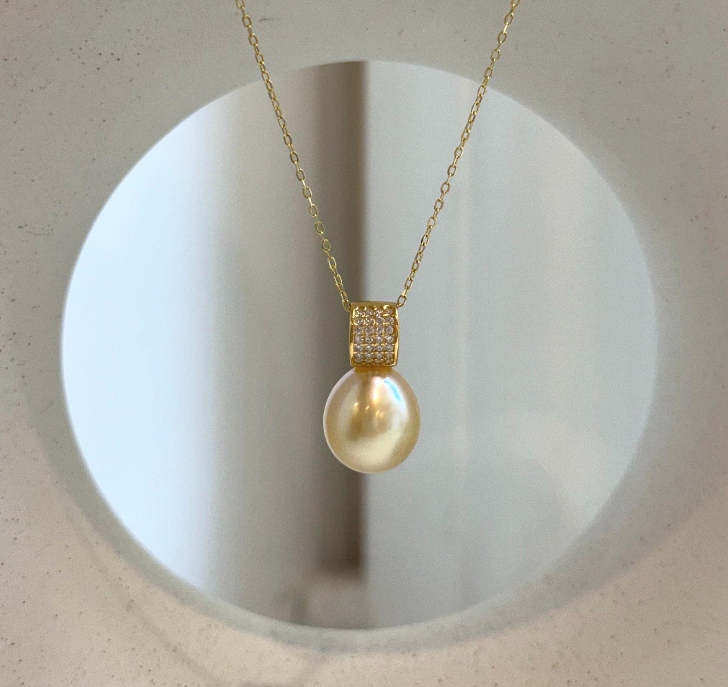 Elly’s 11.4mm South Sea Golden iridescent ocean Pearl pendant: Extreme luster mirrored, 2cm high, S925 silver w/ gold plated pendant.