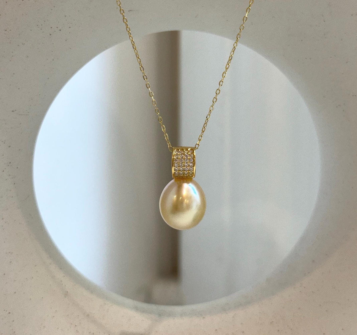 Elly’s 11.4mm South Sea Golden iridescent ocean Pearl pendant: Extreme luster mirrored, 2cm high, S925 silver w/ gold plated pendant.