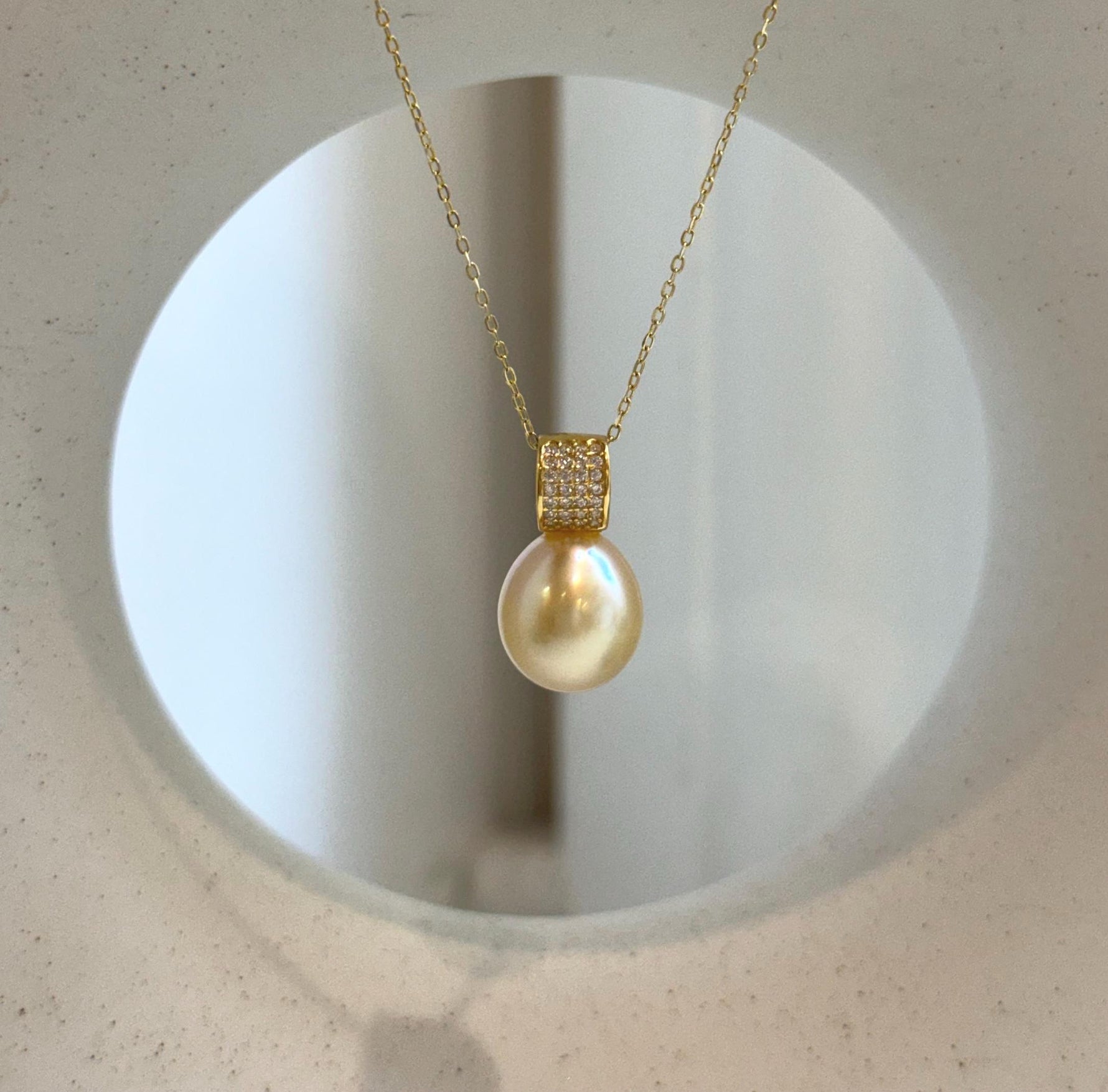 Elly’s 11.4mm South Sea Golden iridescent ocean Pearl pendant: Extreme luster mirrored, 2cm high, S925 silver w/ gold plated pendant.