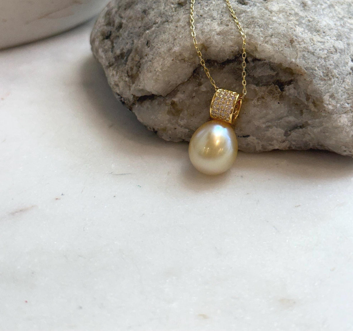 Elly’s 11.4mm South Sea Golden iridescent ocean Pearl pendant: Extreme luster mirrored, 2cm high, S925 silver w/ gold plated pendant.