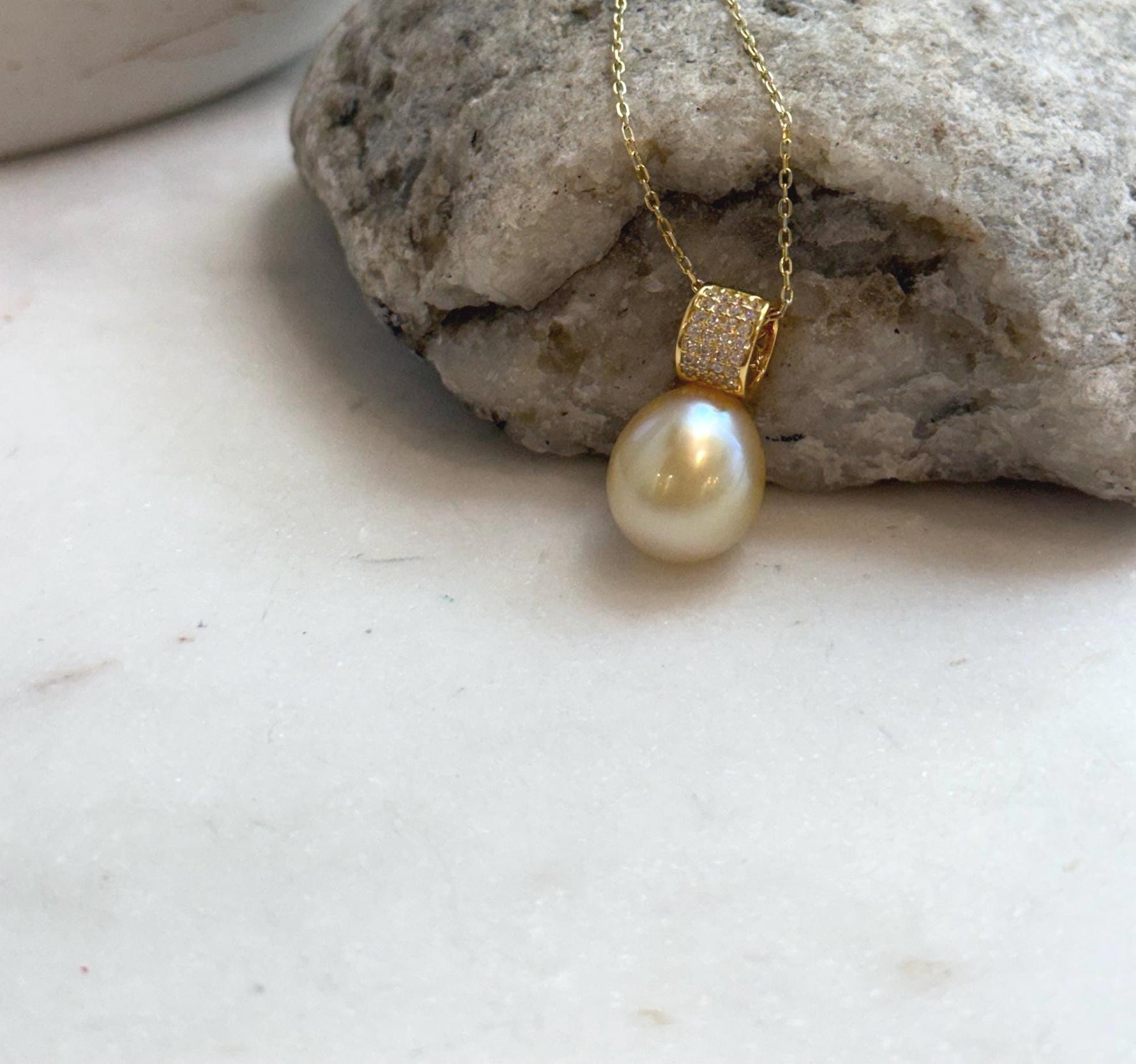 Elly’s 11.4mm South Sea Golden iridescent ocean Pearl pendant: Extreme luster mirrored, 2cm high, S925 silver w/ gold plated pendant.