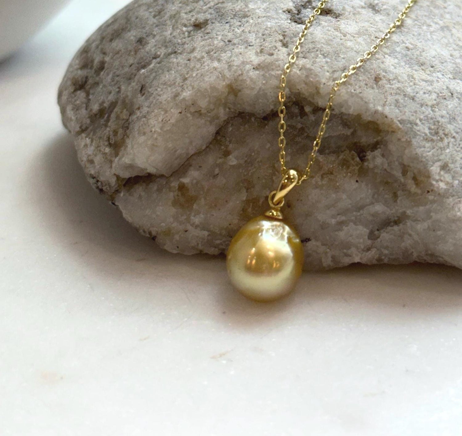 Elly’s 10.8mm South Sea deep tea Gold ocean Pearl pendant: Extreme luster mirrored, 1.9cm high, S925 silver w/ gold plated pendant.
