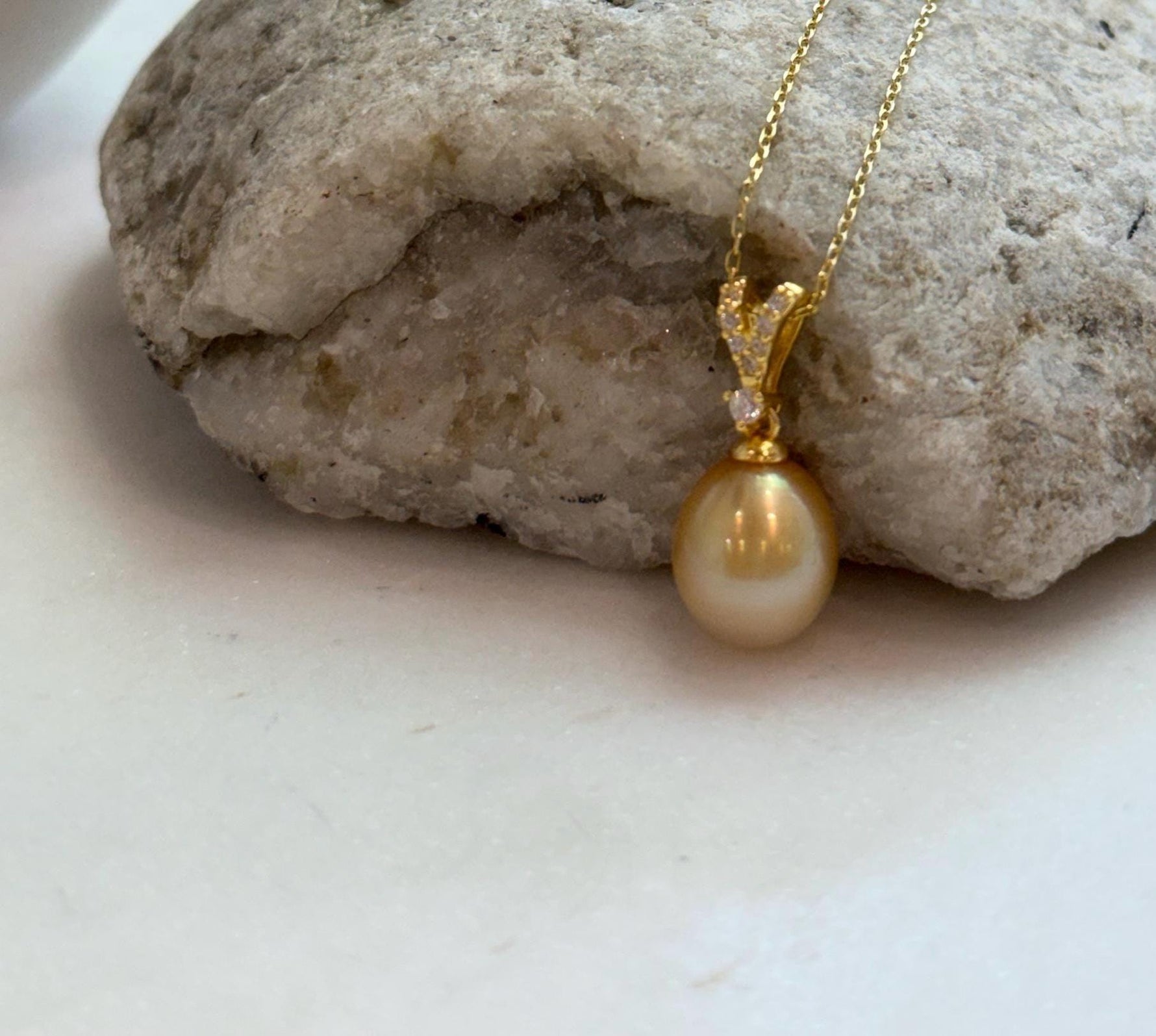 Elly’s 10mm South Sea deep Gold iridescent ocean Pearl pendant: Extreme luster mirrored, 2.2cm high, S925 silver w/ gold plated pendant.