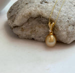 Elly’s 10mm South Sea deep Gold iridescent ocean Pearl pendant: Extreme luster mirrored, 2.2cm high, S925 silver w/ gold plated pendant.