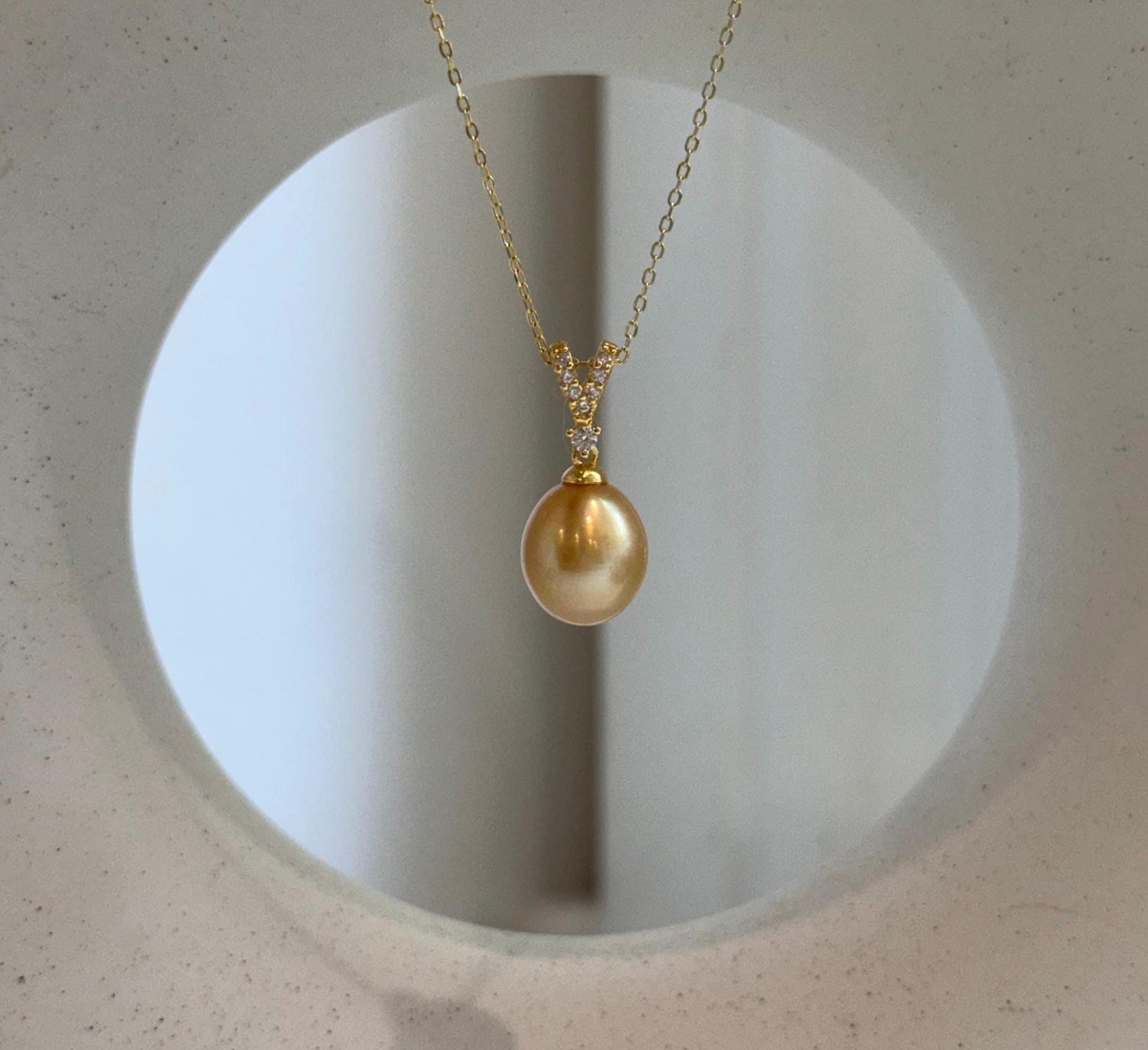 Elly’s 10mm South Sea deep Gold iridescent ocean Pearl pendant: Extreme luster mirrored, 2.2cm high, S925 silver w/ gold plated pendant.