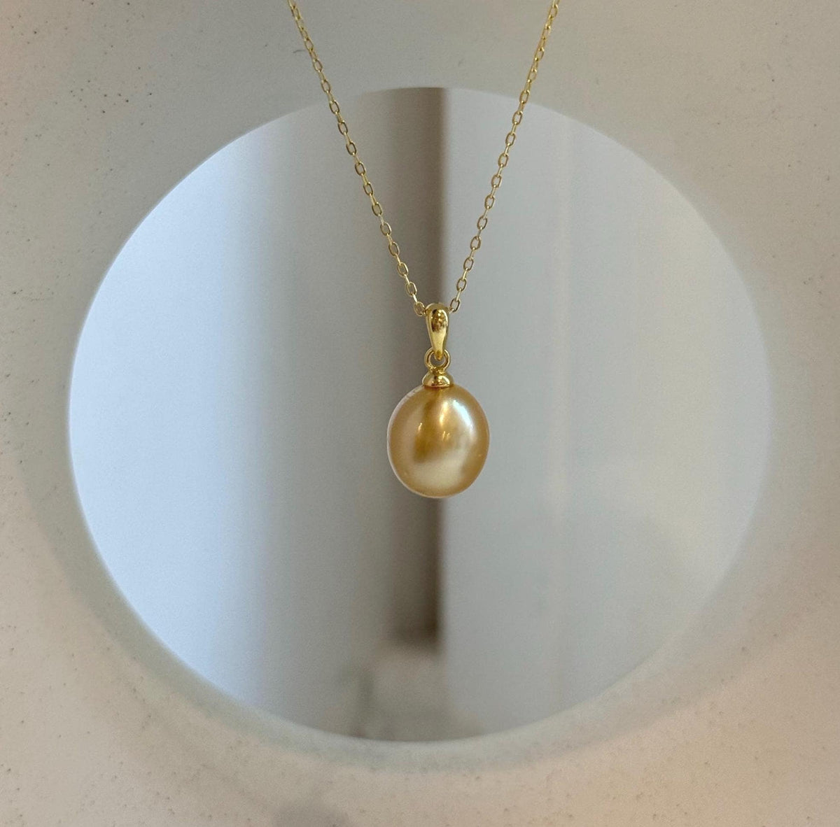 Elly’s 10.2mm South Sea deep tea Gold ocean Pearl pendant: Extreme luster mirrored, 1.9cm high, S925 silver w/ gold plated pendant.