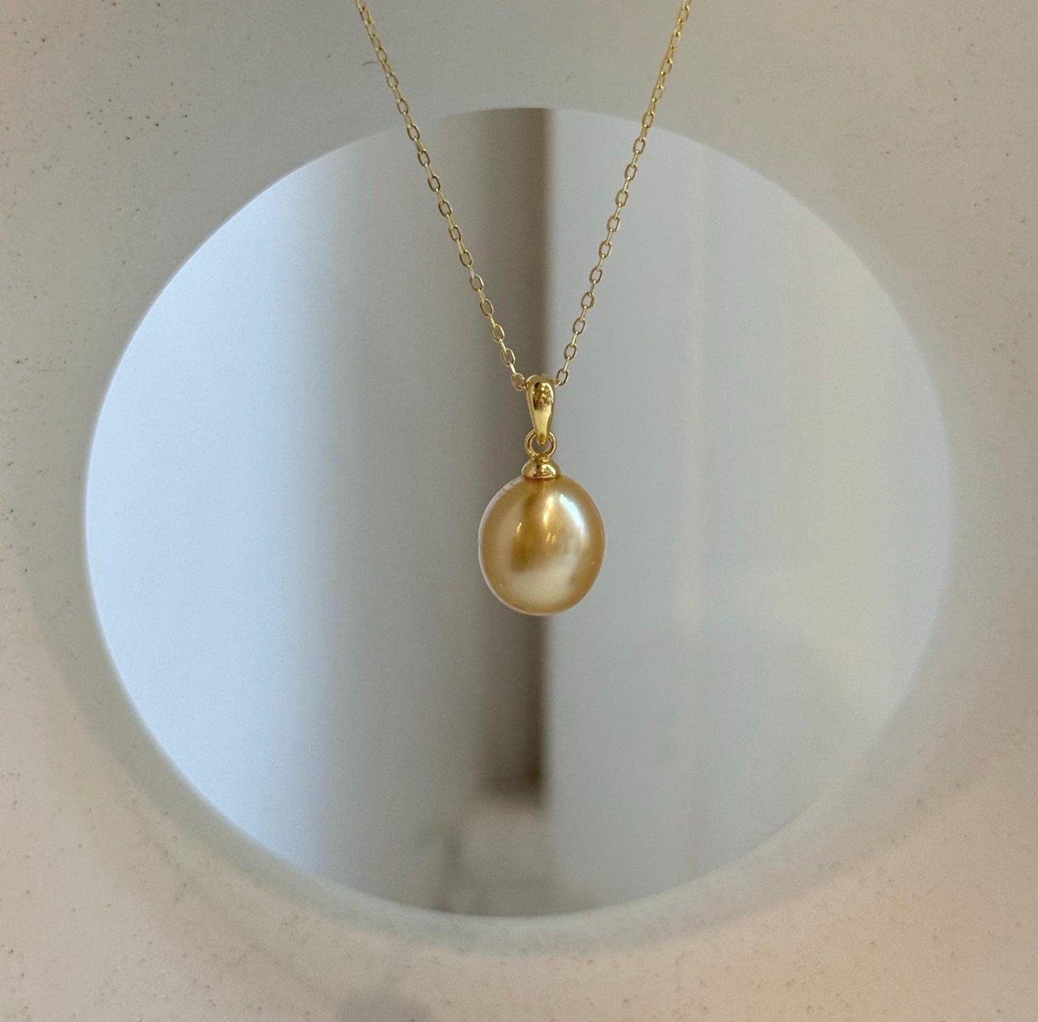 Elly’s 10.2mm South Sea deep tea Gold ocean Pearl pendant: Extreme luster mirrored, 1.9cm high, S925 silver w/ gold plated pendant.