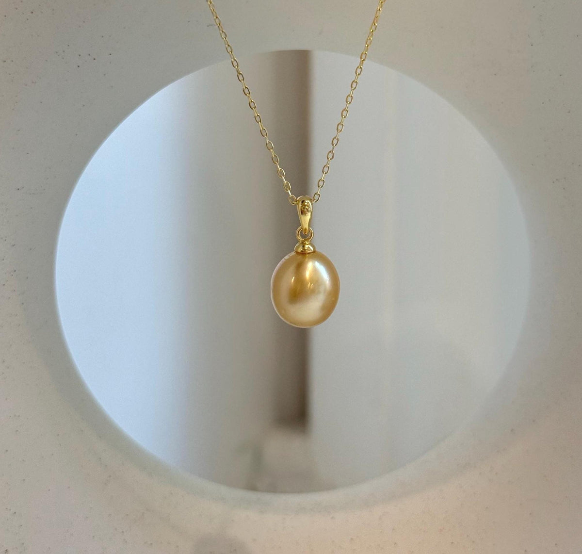 Elly’s 10.2mm South Sea deep tea Gold ocean Pearl pendant: Extreme luster mirrored, 1.9cm high, S925 silver w/ gold plated pendant.
