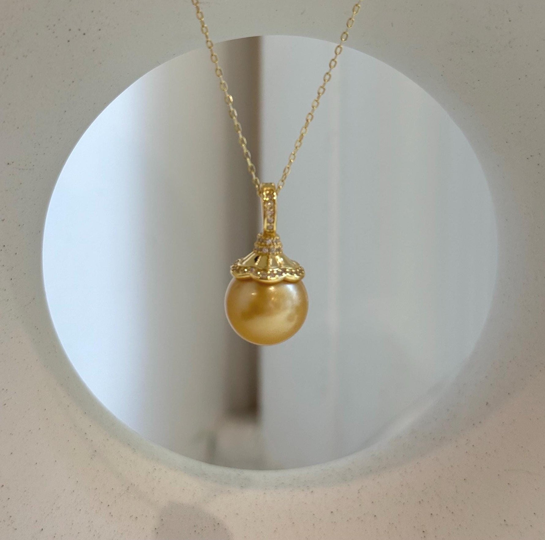 Elly’s 12.6mm South Sea deep Gold ocean Pearl pendant: Extreme luster mirrored, 2.4cm high, S925 silver w/ gold plated pendant.