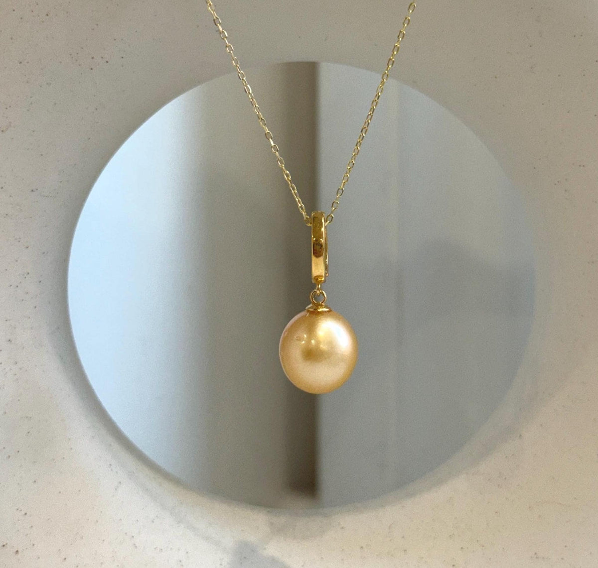 Elly’s 11.9mm South Sea deep Gold ocean Pearl pendant: Extreme luster mirrored, 2.7cm high, S925 silver w/ gold plated pendant.