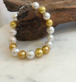 Elly’s 17pcs 10.2-11.5mm White golden Edison Pearls Bracelet: Extreme luster mirrored, 8.3” knotted, S925 silver Bracelet.