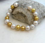 Elly’s 17pcs 10.2-11.5mm White golden Edison Pearls Bracelet: Extreme luster mirrored, 8.3” knotted, S925 silver Bracelet.