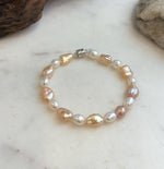 Elly’s 6.6-8.5mm Freshwater Multicolored Pearls Bracelet: Extreme luster mirrored, 7.8”, S925 silver bracelet.